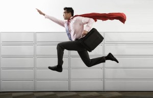 Businessman Wearing Cape --- Image by © Royalty-Free/Corbis
